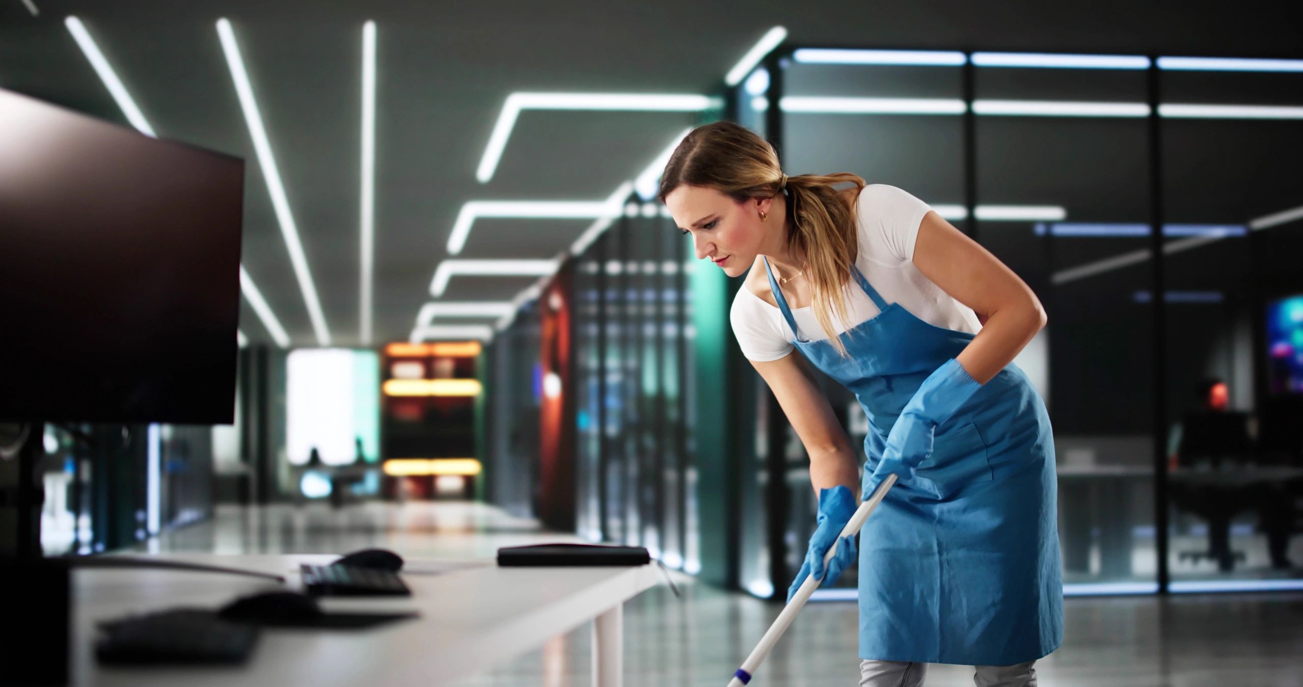 ROL SERVICES team performing janitorial cleaning in a university hallway